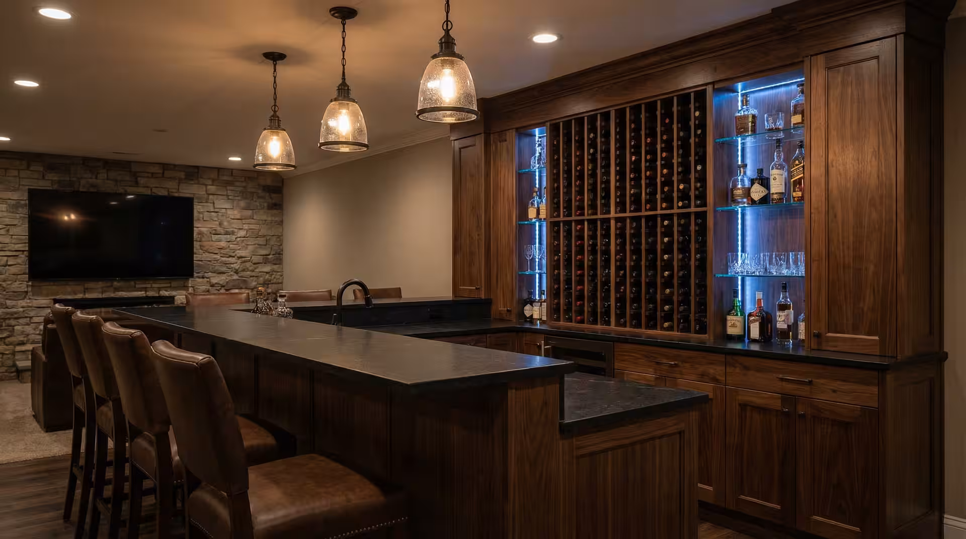 Finished Utah basement wet bar with cabinets and counter seating